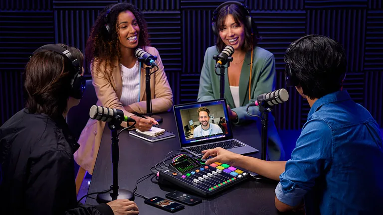 Four hosts recording together around a RØDECaster