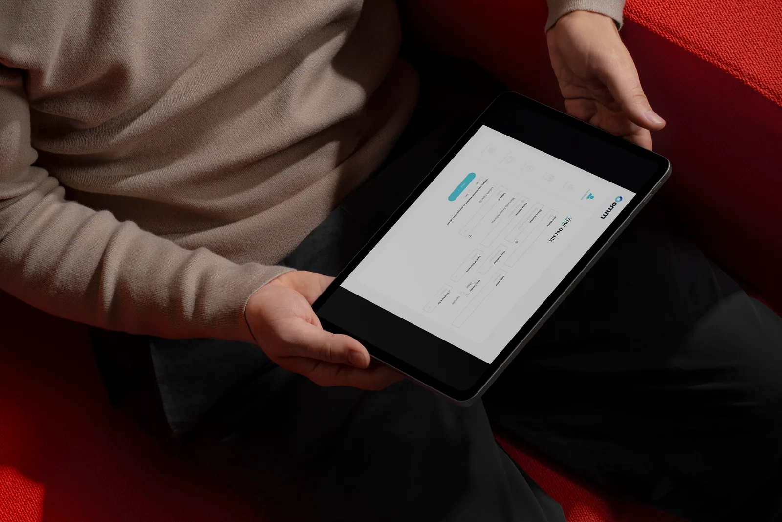 Loan application flow on a tablet held in both hands